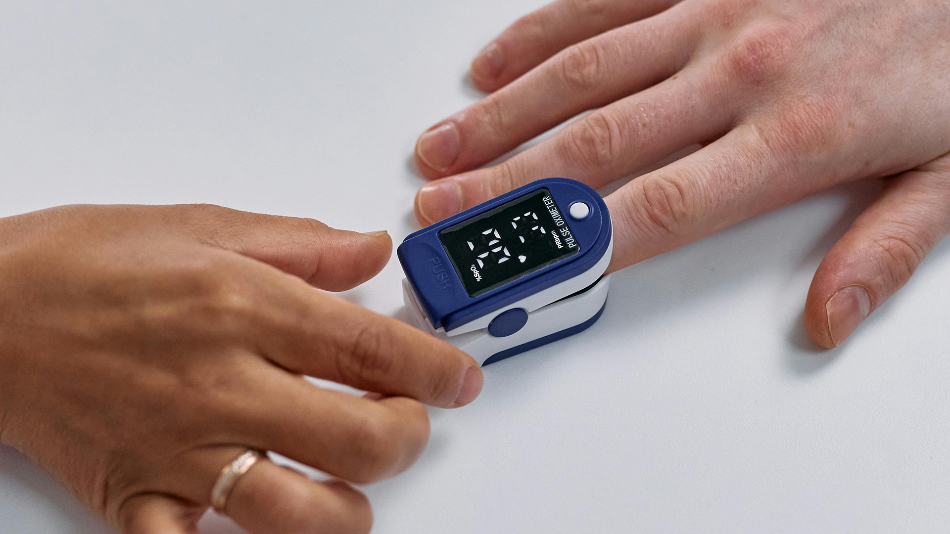 Diabetes insulin reader on a patient's finger.