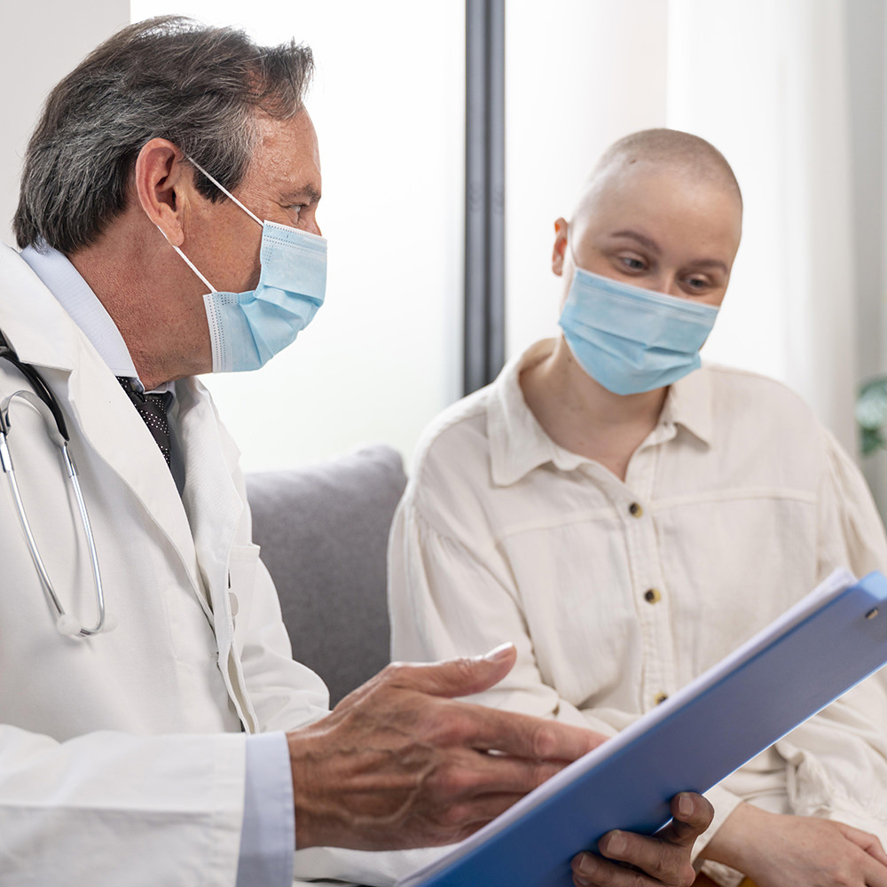 Oncologist discussing results with a cancer patient.