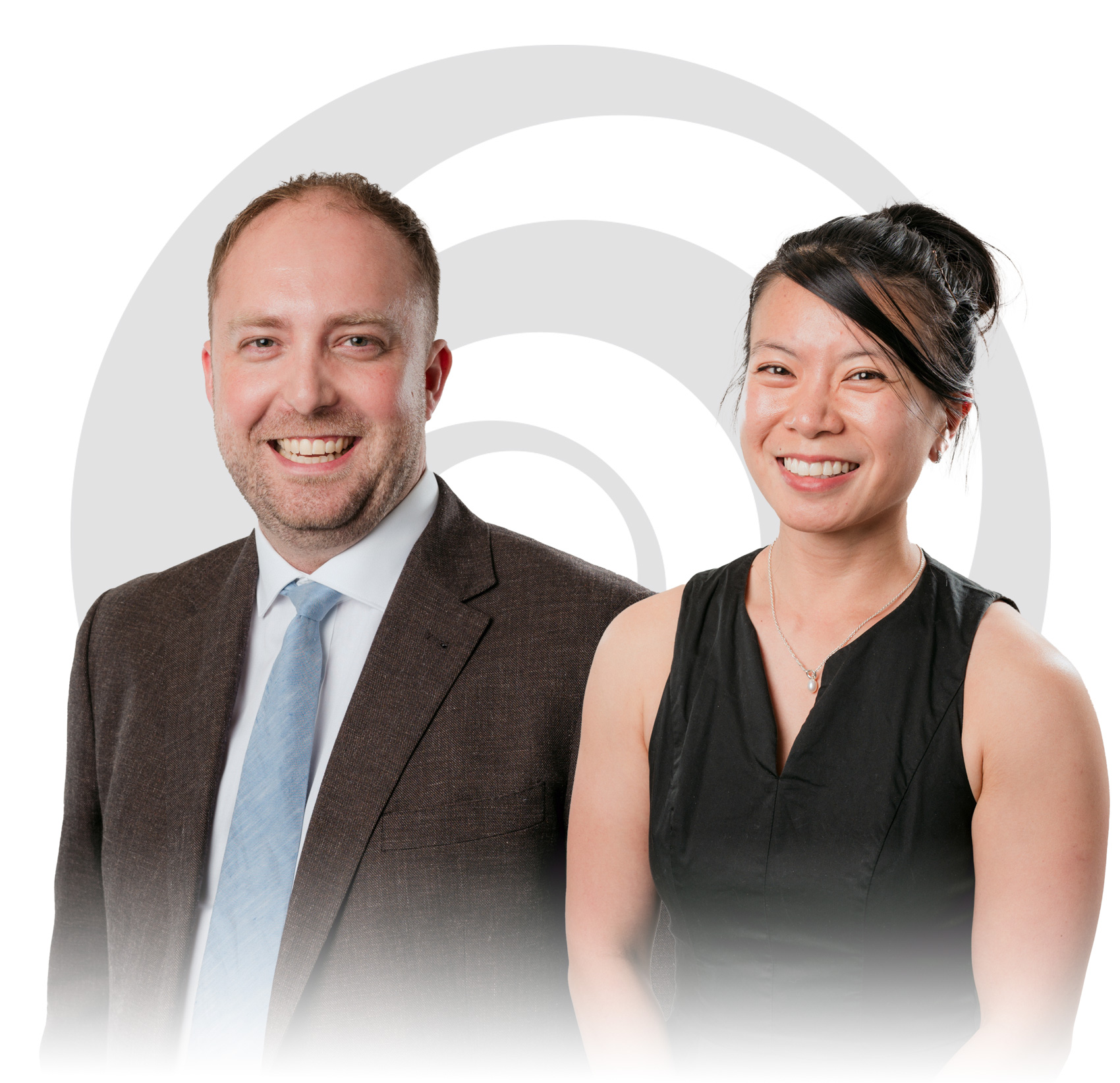 Two South Australian Medical Specialist doctors standing together with the company logo behind them.